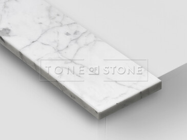 Mramor BIANCO CARRARA, detail. Přírodní kámen původem z Itálie s unikátním bílým zbarvením a decentní nepravidelnou kresbou patří mezi exkluzivní přírodní kameny. Vhodný pro výrobu parapetů do interiérů i exteriérů. Mramor BIANCO CARRARA, detail. Přírodní kámen původem z Itálie s unikátním bílým zbarvením a decentní nepravidelnou kresbou patří mezi exkluzivní přírodní kameny. Vhodný pro výrobu parapetů do interiérů i exteriérů.